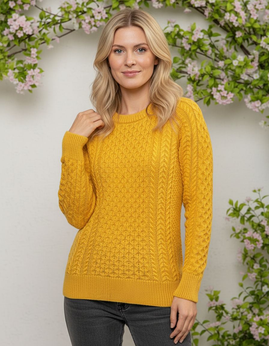 Woman wearing a yellow cable knit sweater with a floral background